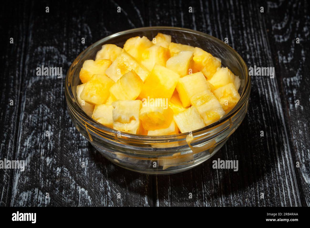 sliced pineapple on wood background Stock Photo