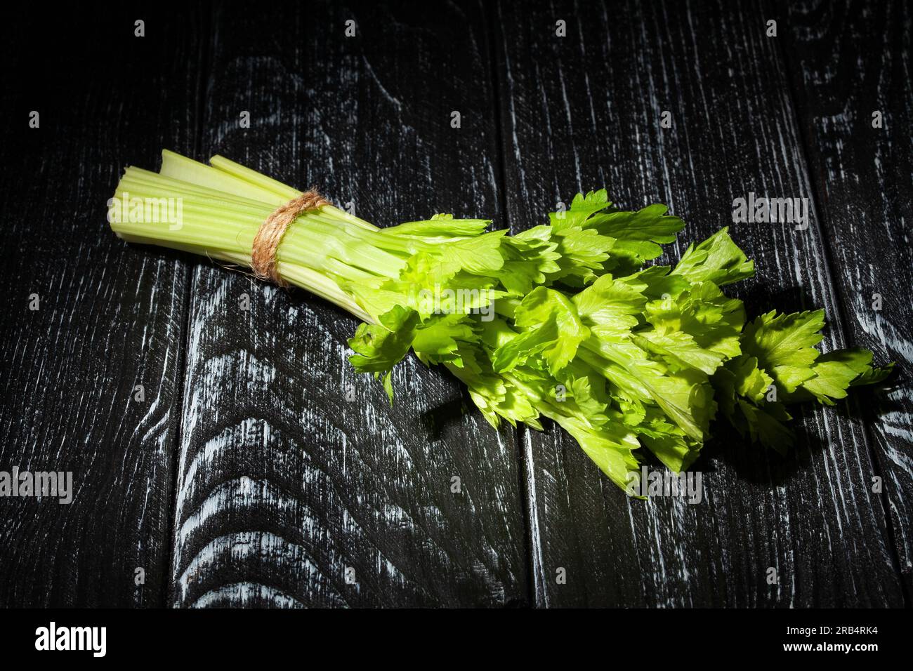 celery sticks bunch on wood background Stock Photo