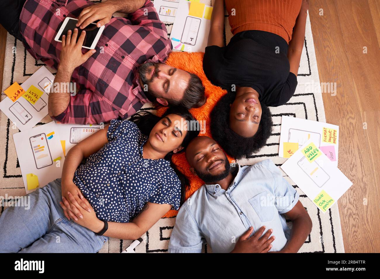 Overhead shot of multiracial group of developers and designers sleeping start up Stock Photo