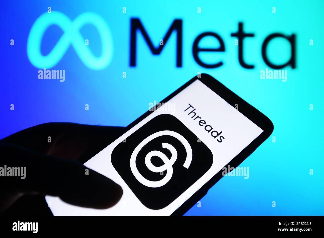 In this photo illustration, a Threads logo seen displayed on a ...