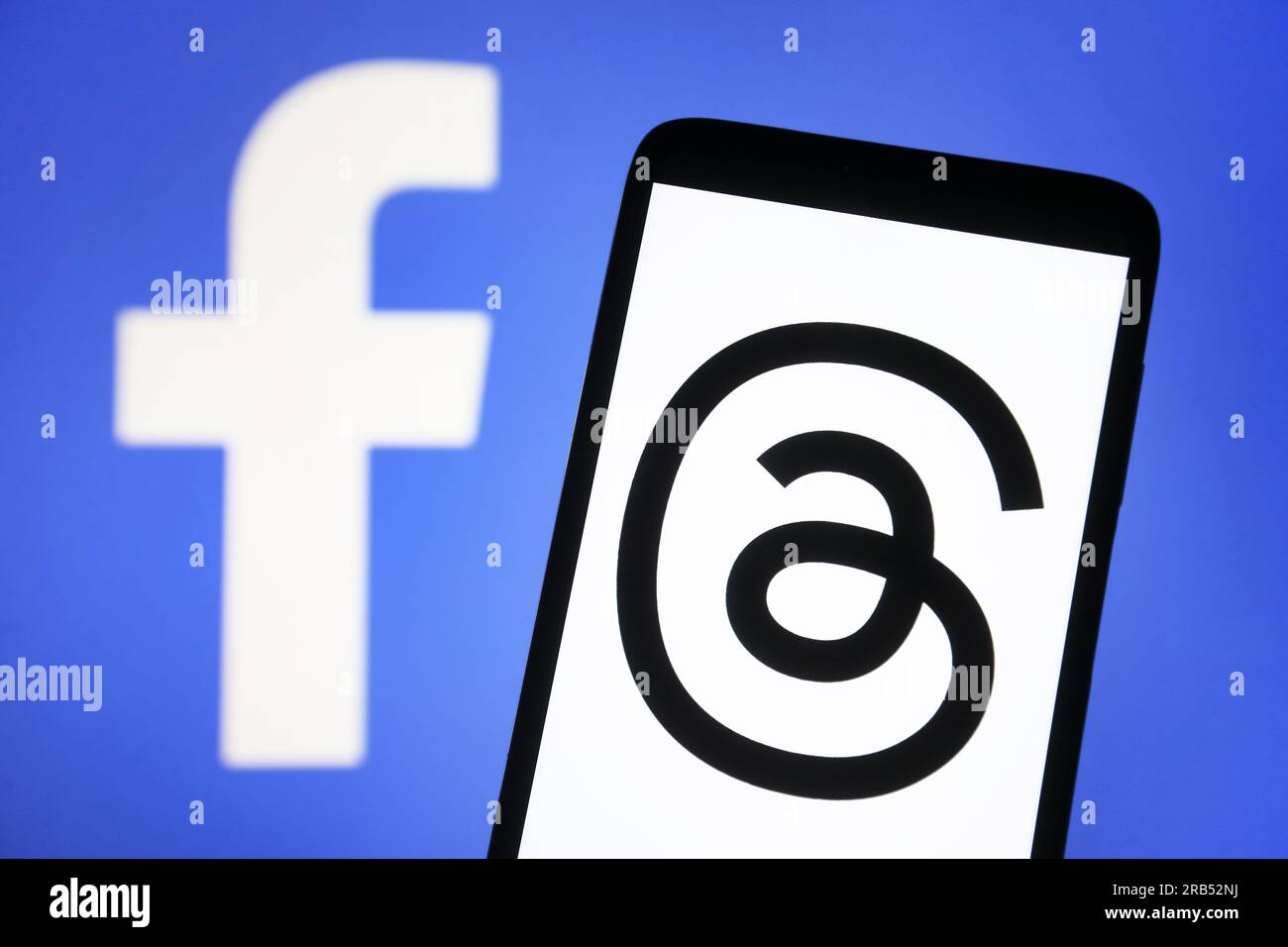 In this photo illustration, a Threads logo seen displayed on a ...