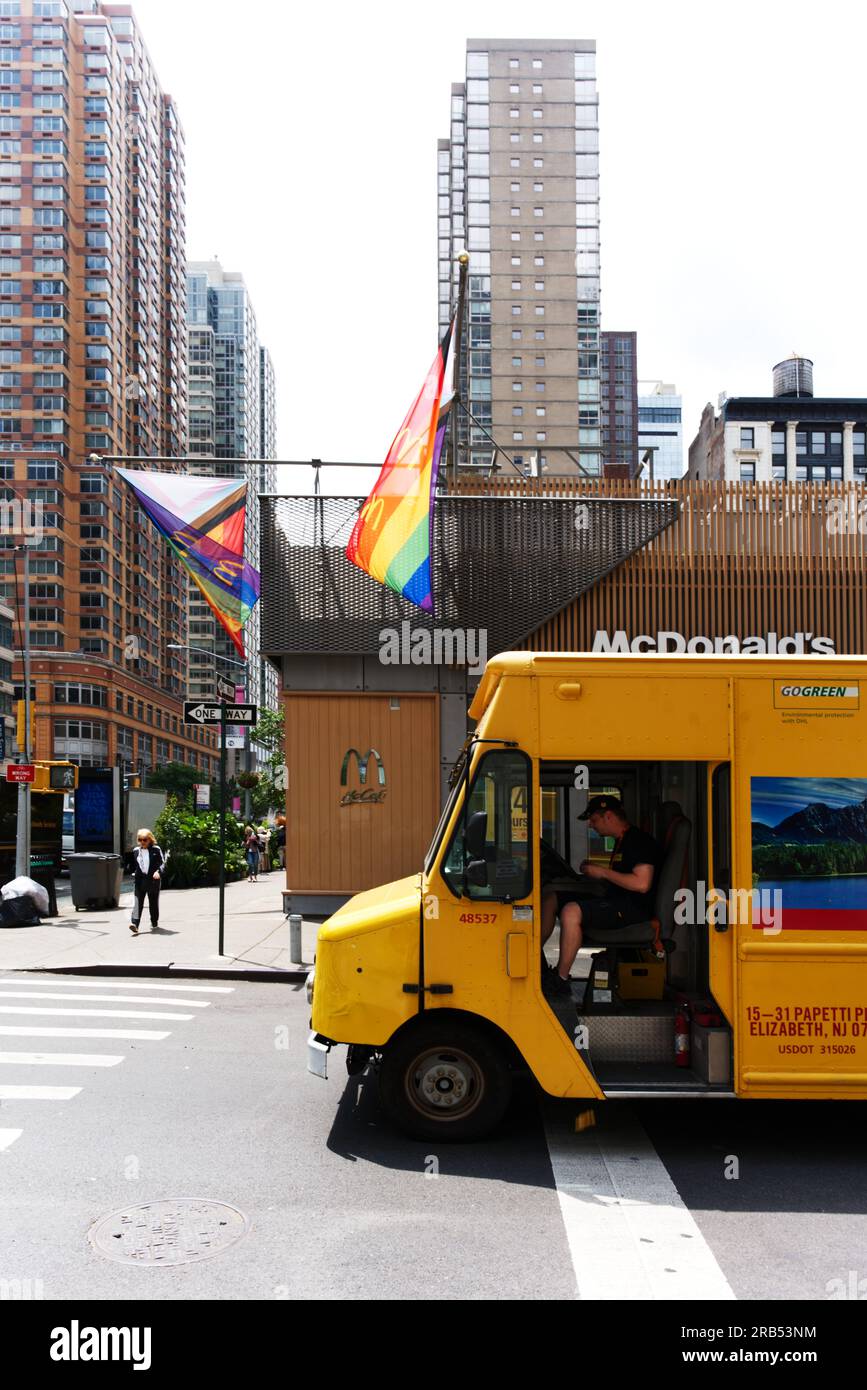 DHL delivery truck and McDonald's with LGBTQ+ Flags Stock Photo