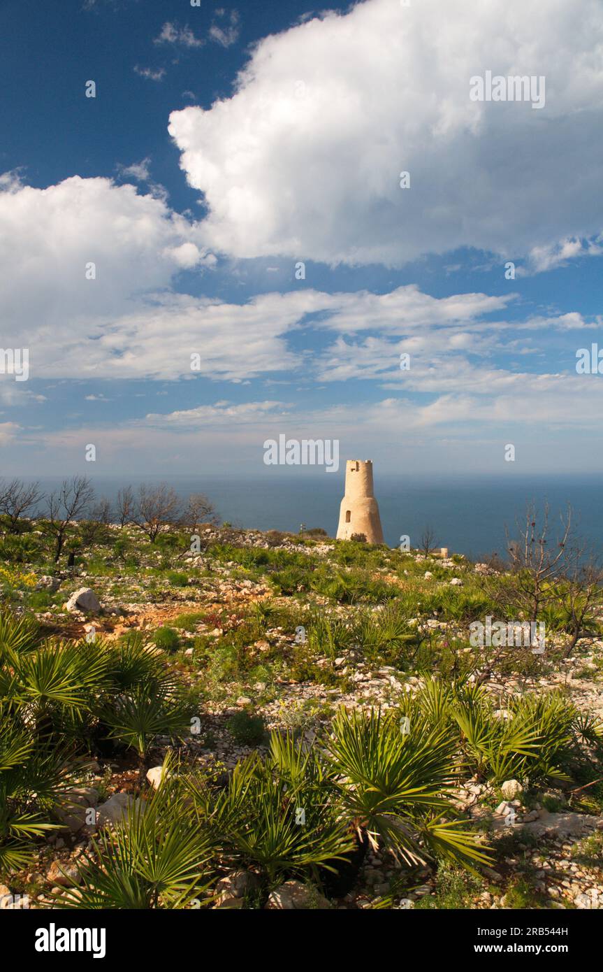 Landscape of the natural park of El Montgó in Denia, Alicante, in which one of its watchtowers stands out. Paisaje del parque natural de El Montgó de Stock Photo
