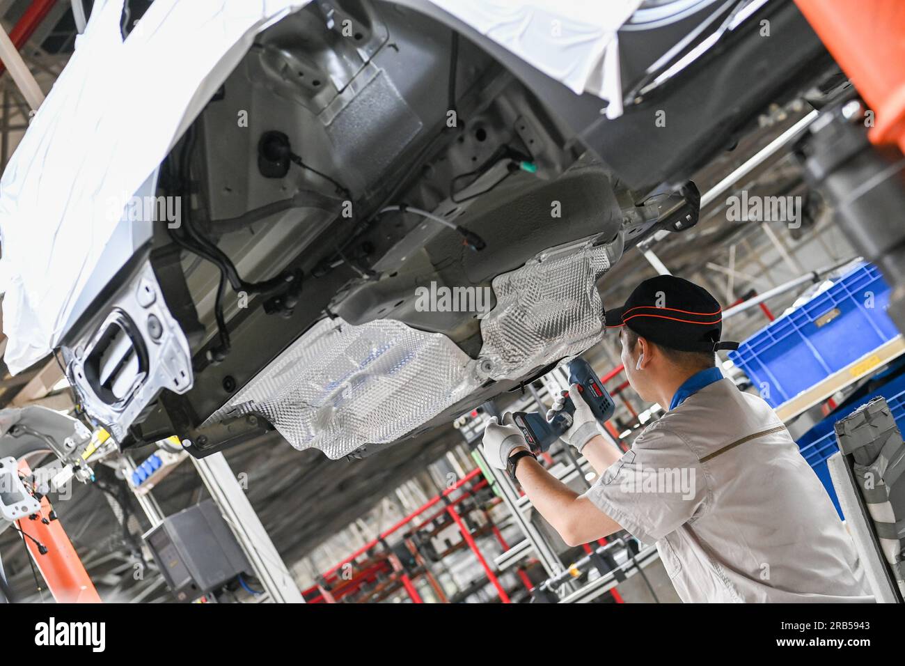Changchun, China. 07th July, 2023. (230707) -- CHANGCHUN, July 7, 2023 (Xinhua) -- This photo taken on June 12, 2023 shows a worker assembling vehicles at the general assembly line of FAW-Volkswagen in Changchun, northeast China's Jilin Province. Founded in 1953 in Changchun, First Automotive Works (FAW) Group Corporation is dubbed the cradle of China's auto industry. As one of China's leading automakers, FAW Group Corporation will celebrate its 70th anniversary of establishment on July 15, 2023. (Xinhua/Yan Linyun) Credit: Xinhua/Alamy Live News Stock Photo