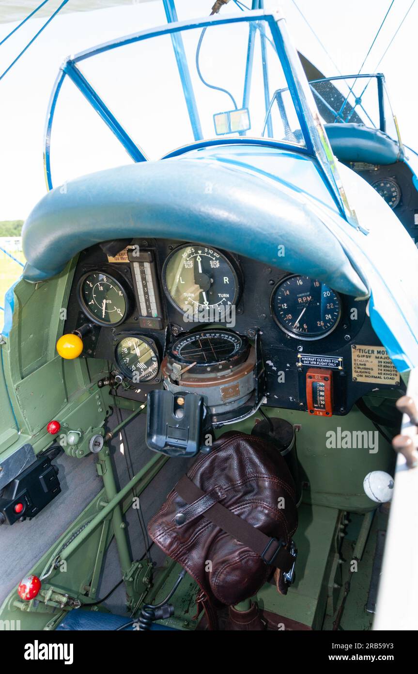 Rear cockpit of a Tiger Moth on display at a wings and wheels event in the countryside at Heveningham Hall. De Havilland D.H. 82A Tiger Moth Stock Photo