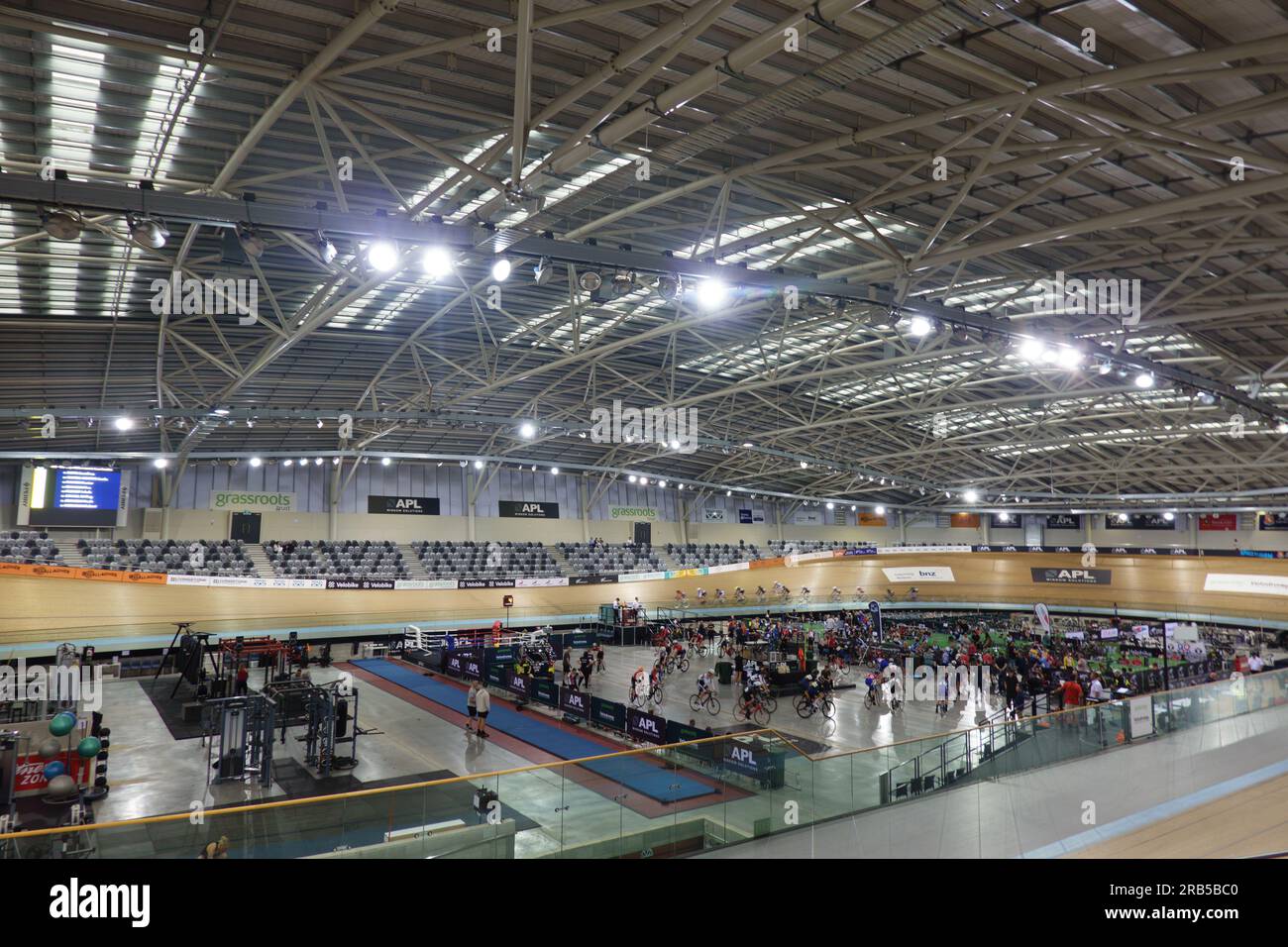 Cambridge New Zealand - July 4 2023; Cycling event with riders blurred in motion inside velodrome. Stock Photo