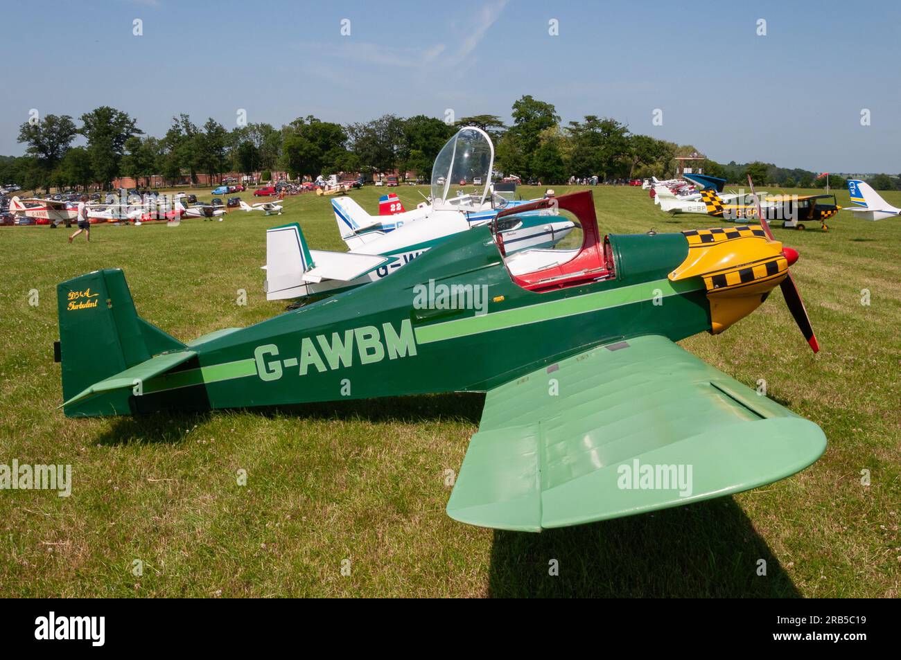 Planes on display at a wings and wheels event in the countryside at