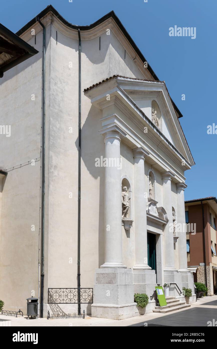 view of san Martino church facade, shot in bright light at Marano Lagunare, Udine, Friuli, Italy Stock Photo