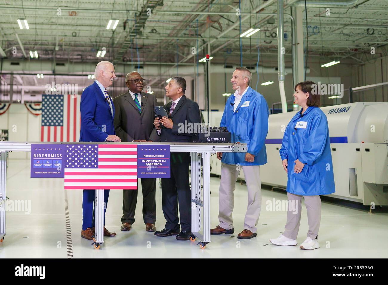 West Colombia, United States of America. 06 July, 2023. U.S President Joe Biden, left, and Rep. Jim Clyburn, D-S.C, listen to Raghu Belur, Co-Founder of Enphase Energy, center, during a tour of Flex LTDC, July 6, 2023 in West Colombia, South Carolina. Biden announced a new partnership with Enphase to bring 600 new jobs to South Carolina because of the Biden-Harris Administration build back America plan. Credit: Adam Schultz/White House Photo/Alamy Live News Stock Photo