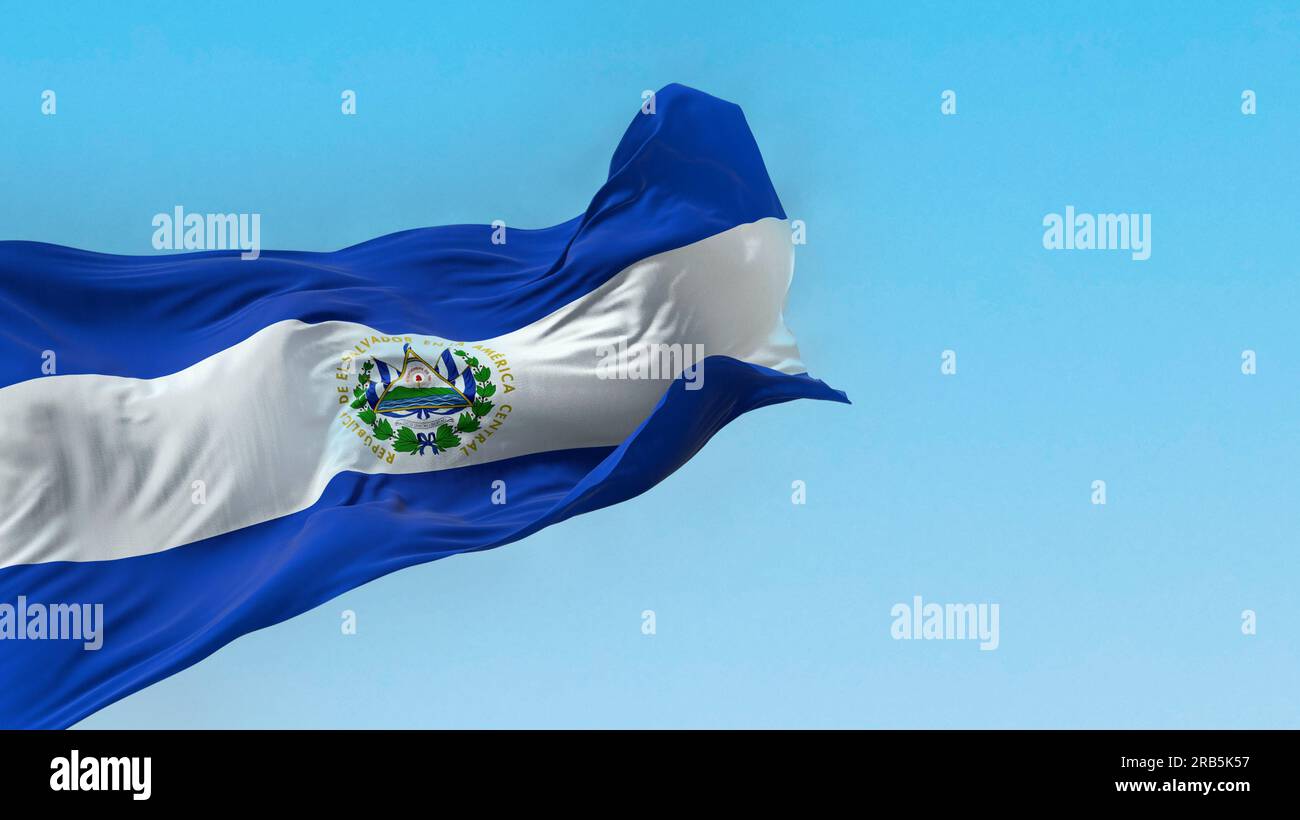 El Salvador national flag waving on a clear day. Three horizontal bands of blue and white with the coat of arms in the center. Central America country Stock Photo