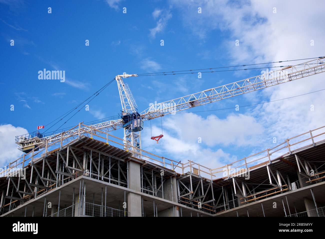 Building construction site with crane - construction machinery Stock Photo