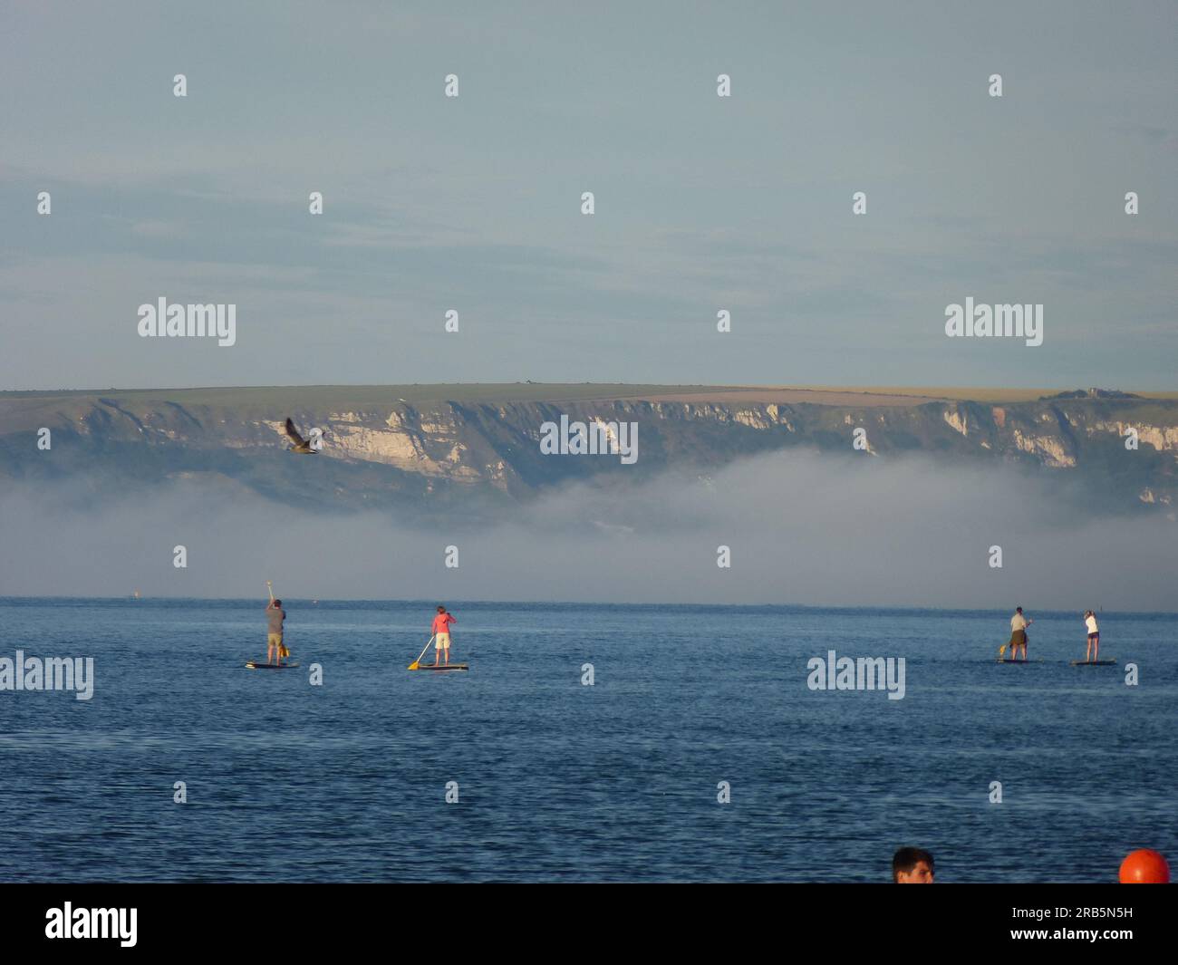 Paddle boards off Weymouth Beach Stock Photo