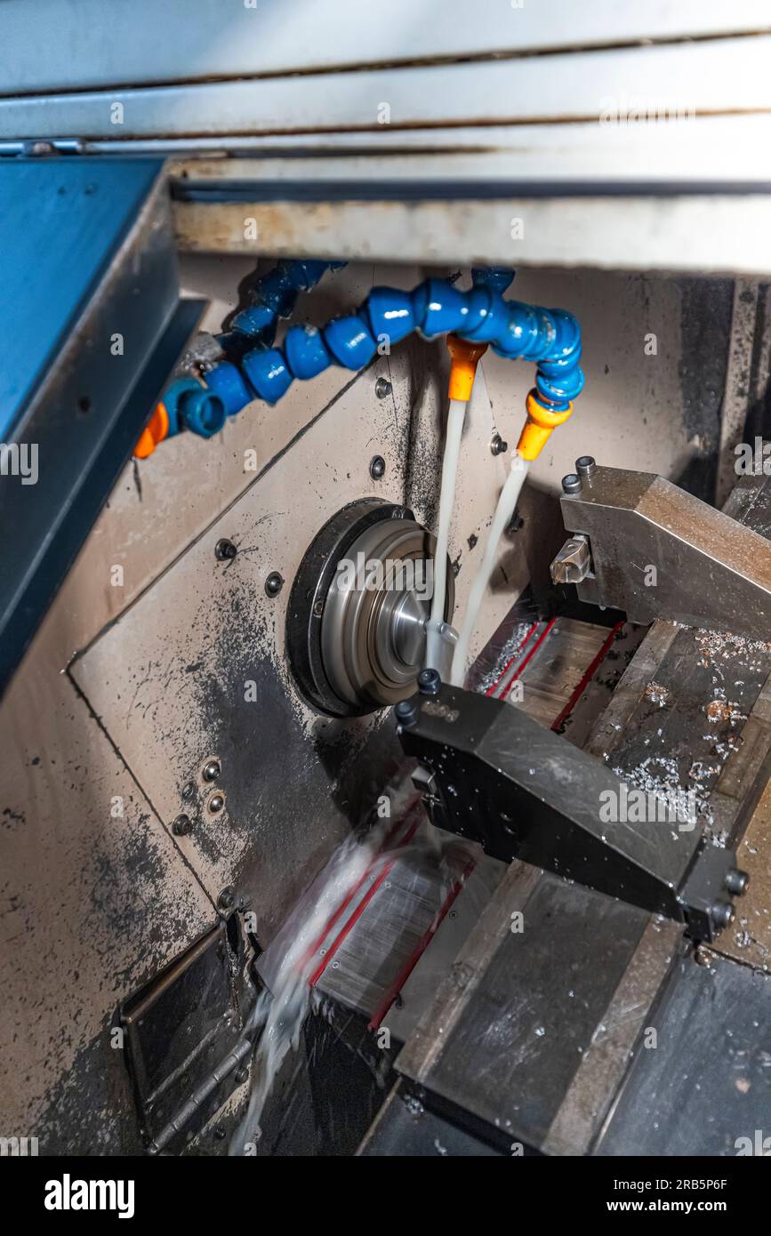 Milling metalworking process. Industrial CNC metalworking with vertical