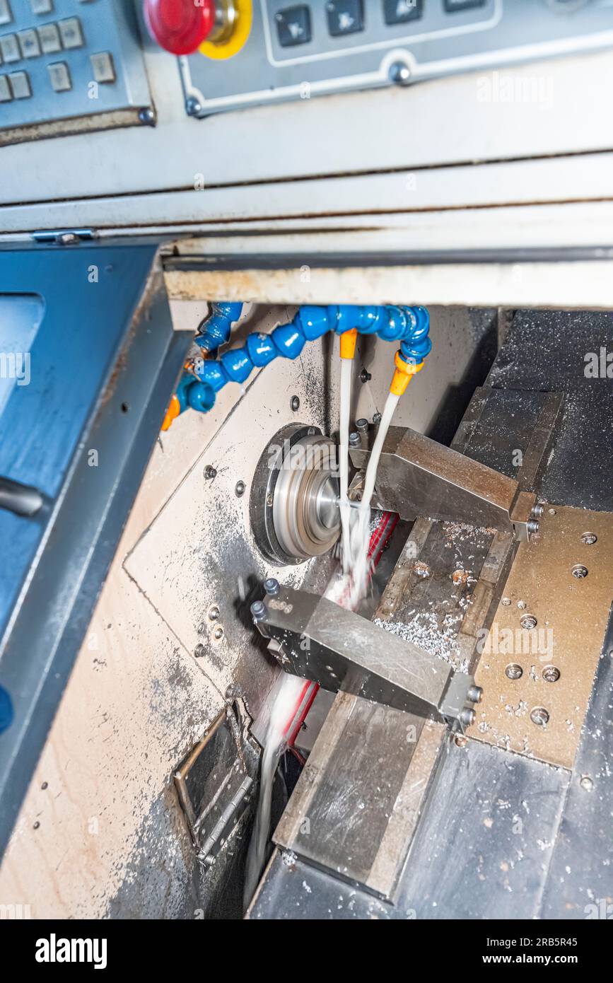 Milling metalworking process. Industrial CNC metalworking with vertical