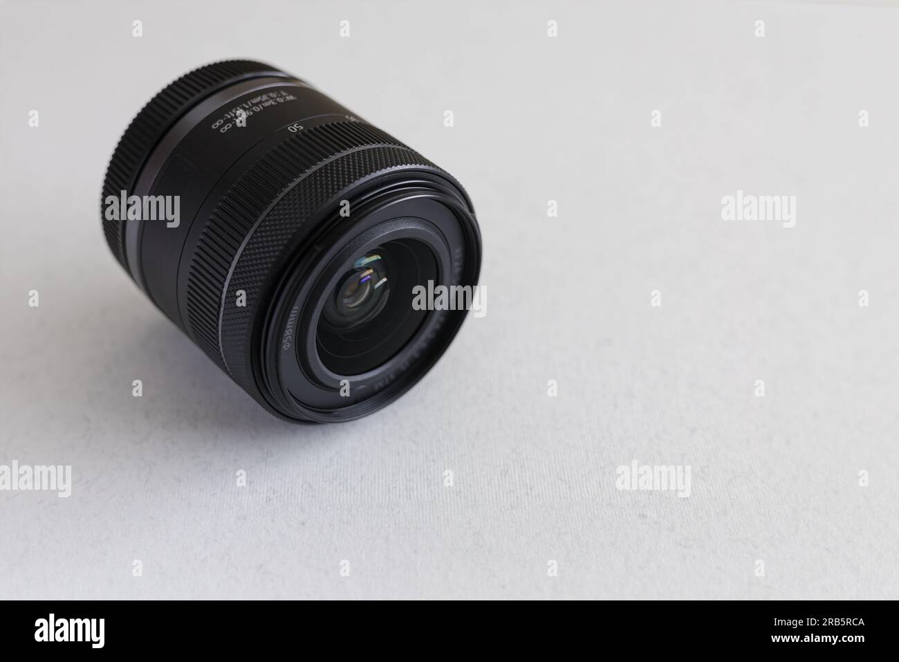 Camera lens on a white background. Close-up. View from above. Stock Photo