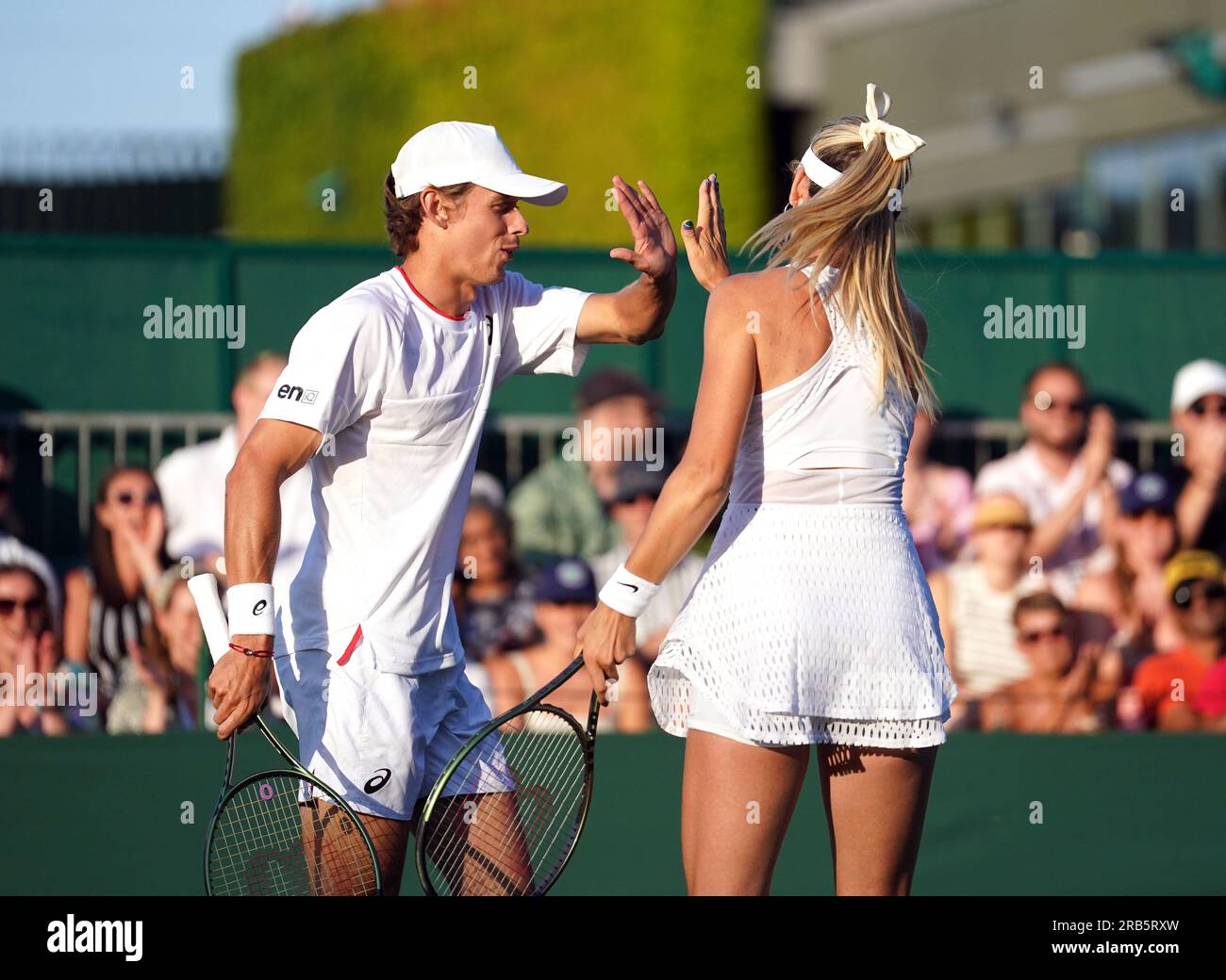 Katie Boulter and Alex De Minaur during their mixed doubles match on