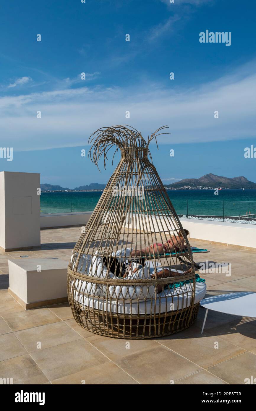 Relaxing on Palma de Maiorca, Mallorca hotels with ocean view to Playa de Muro. Luxury and relaxing vacations on Palma de Mallorca hotel roofs Stock Photo
