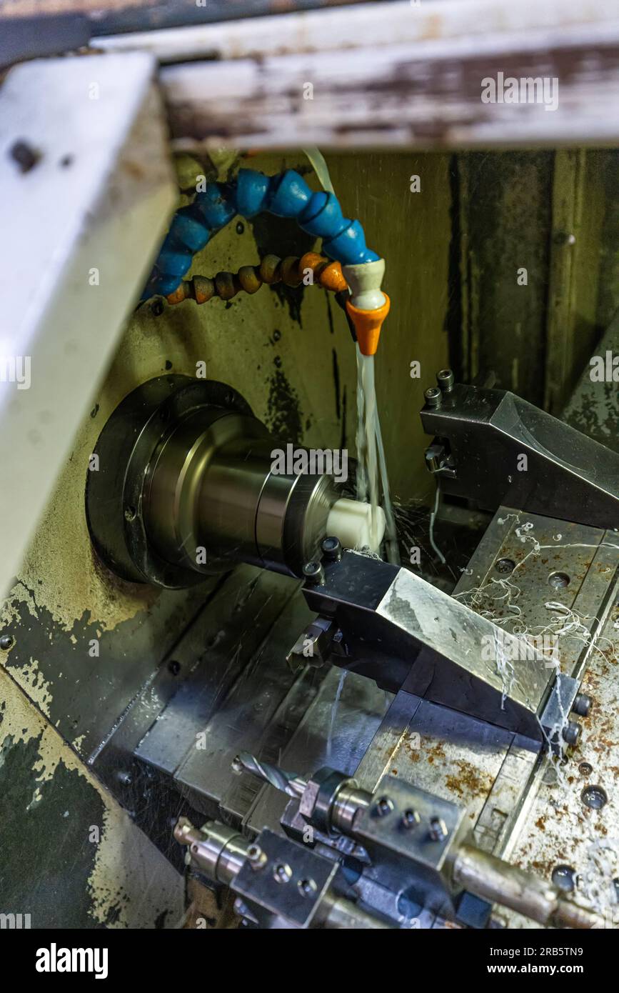 Milling metalworking process. Industrial CNC metalworking with vertical