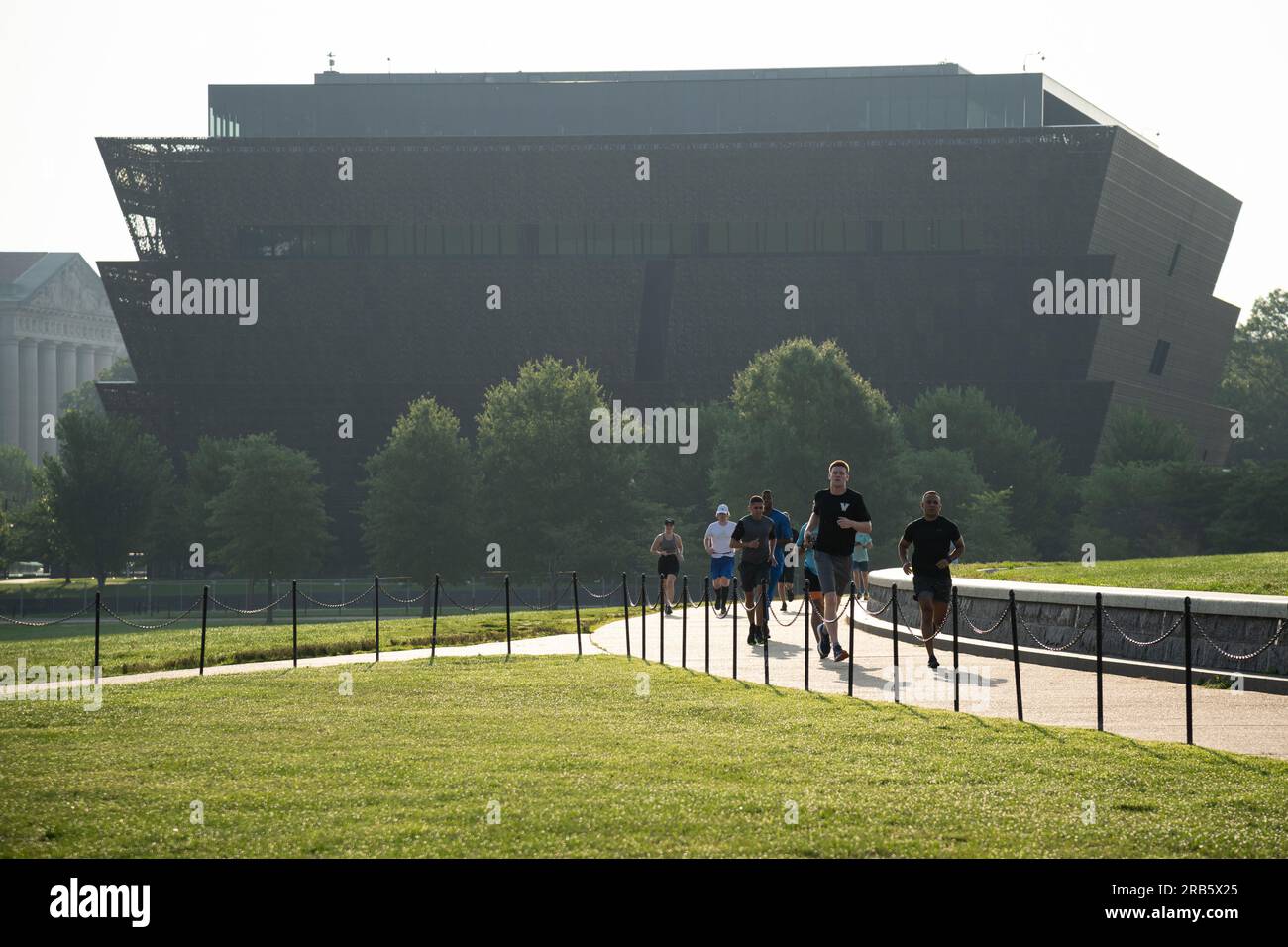 Washington, USA. 07th July, 2023. People are seen running early in the morning on the National Mall, in front of the Smithsonian National Museum of African American History and Culture, in Washington, DC, on Friday, July 7, 2023. (Graeme Sloan/Sipa USA) Credit: Sipa USA/Alamy Live News Stock Photo