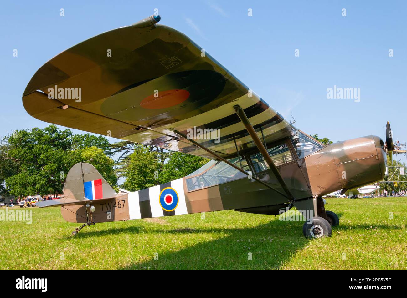 Taylorcraft J Auster Mk5 plane parked on grass airstrip at a wings and wheels event in the countryside at Heveningham Hall. Rural country in Suffolk Stock Photo