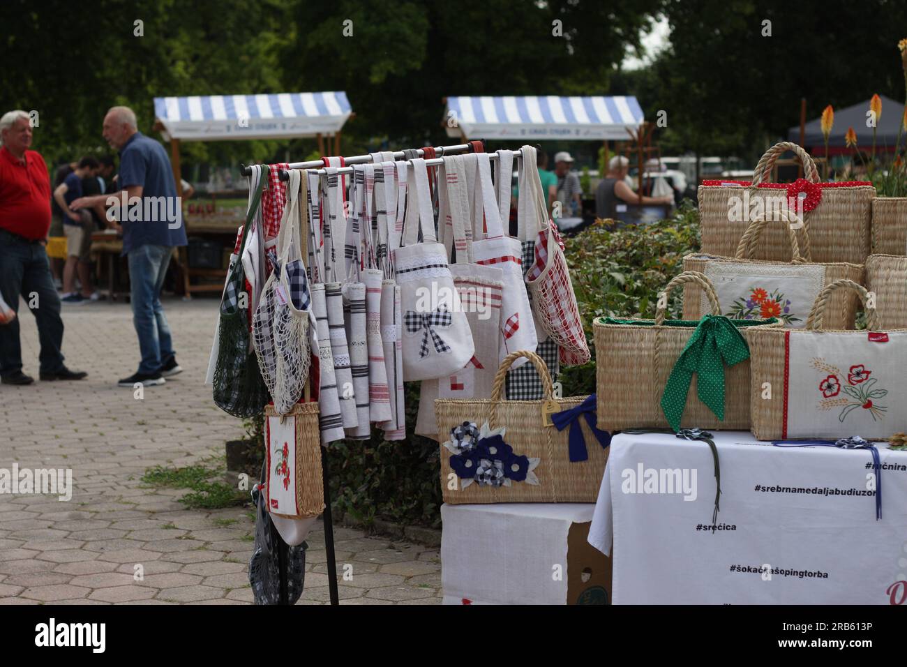 Handmade knitted bags with beautiful details at the antiques fair in Osijek, Croatia, July 1, 2023. Stock Photo