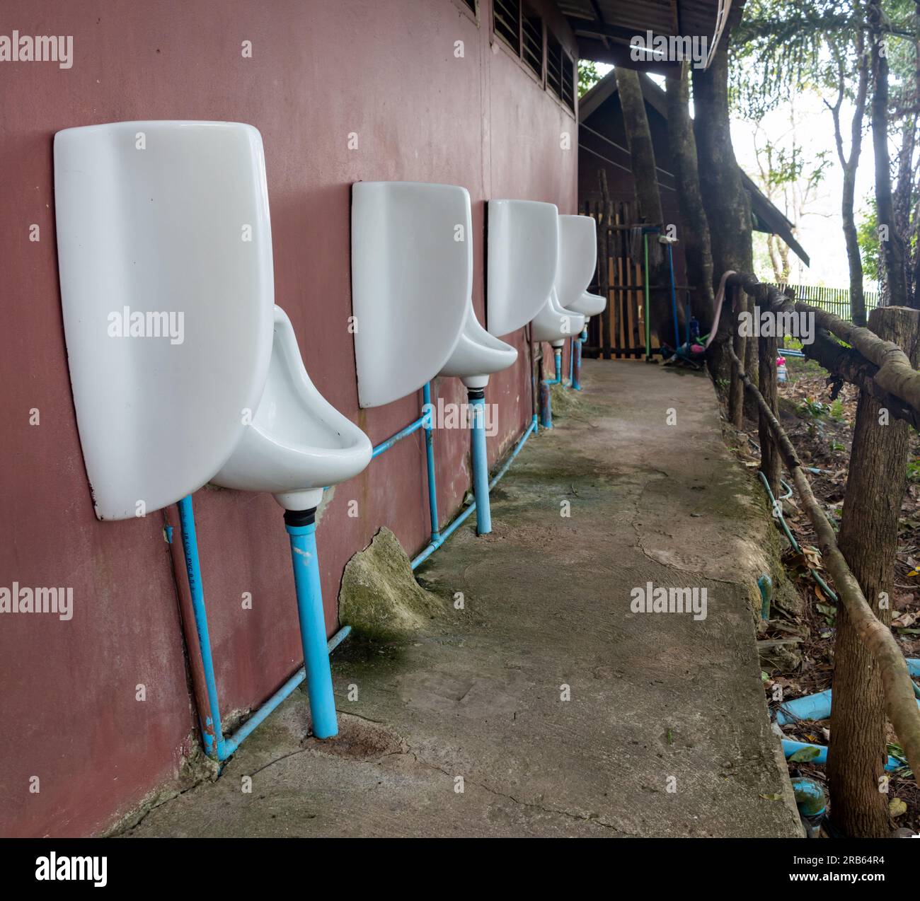 Outdoor men's toilets urinals in the forest restaurant, Thailand