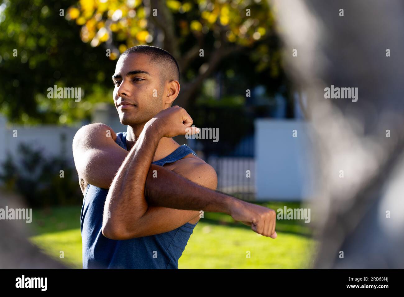 Happy young man stretching arms hi-res stock photography and images - Alamy