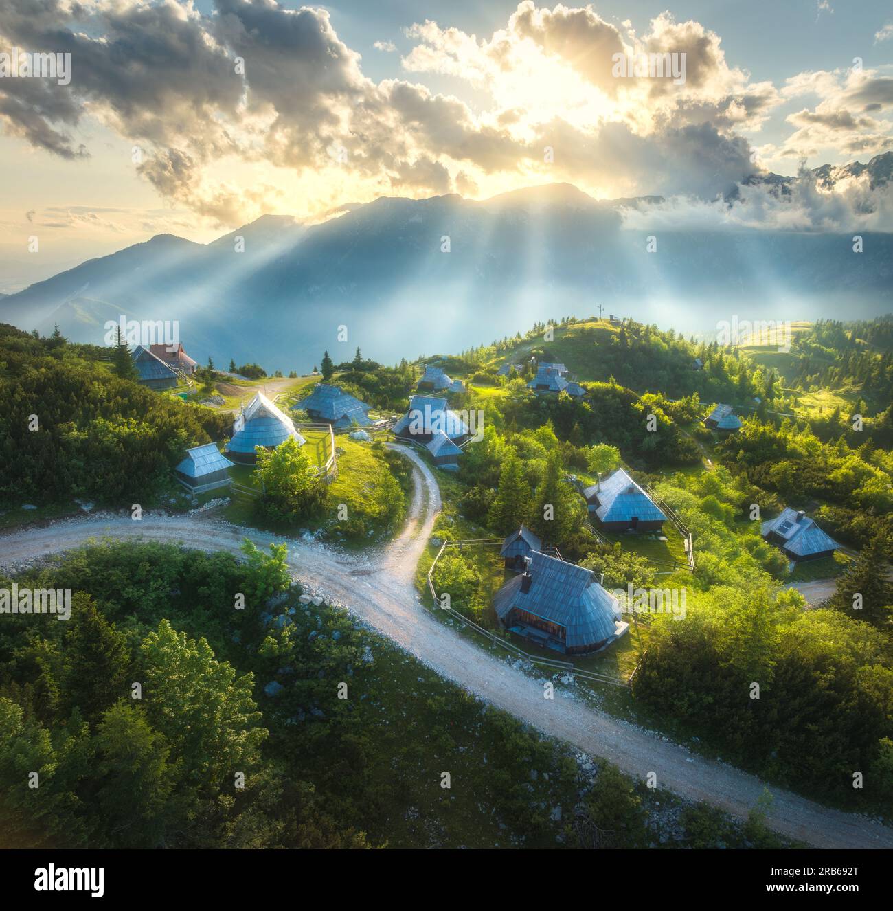 Aerial view of old mountain village on the green hills at sunset Stock ...