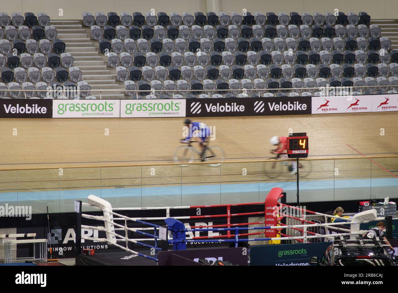 Cambridge New Zealand - July 4 2023; Cycling event with riders blurred in motion inside velodrome. Stock Photo