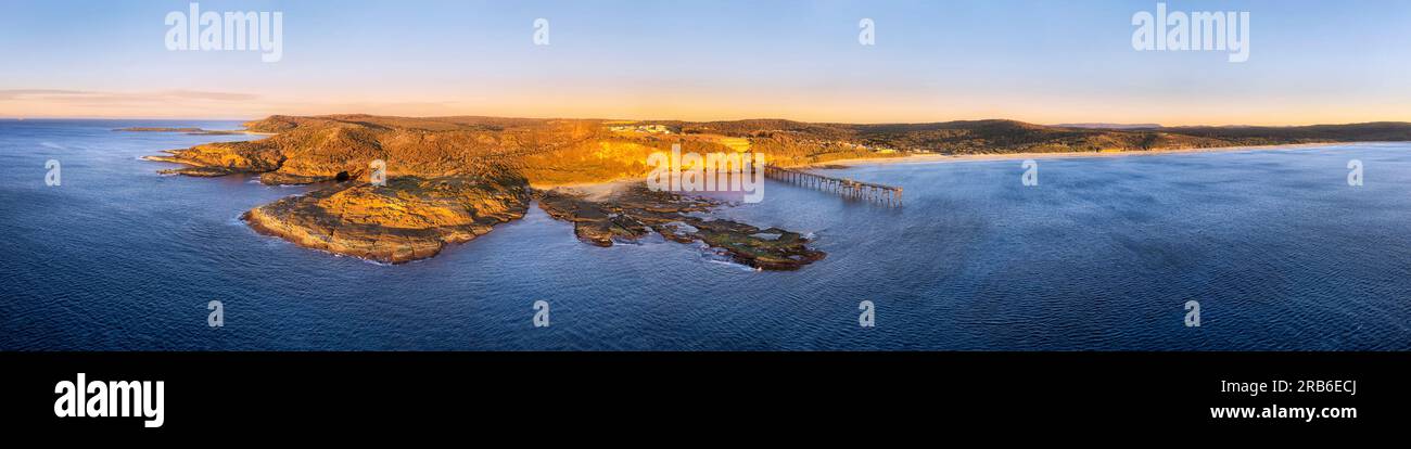 Scenic waterfront of Pacific ocean at Middle camp beach on Catherine Hill bay coast in Australia - aerial sunrise panorama. Stock Photo