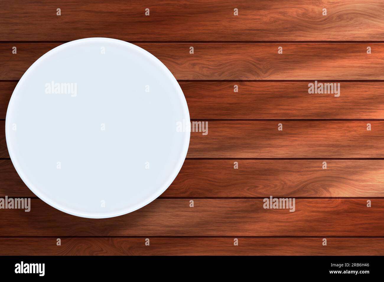 Empty white round plate on wooden background. Stock Photo