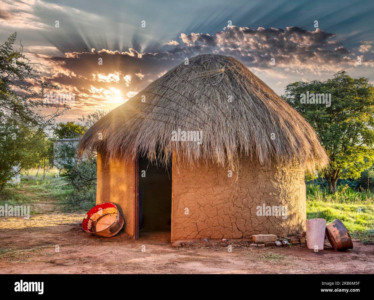 traditional thatched roof hut in a village in botswana Stock Photo