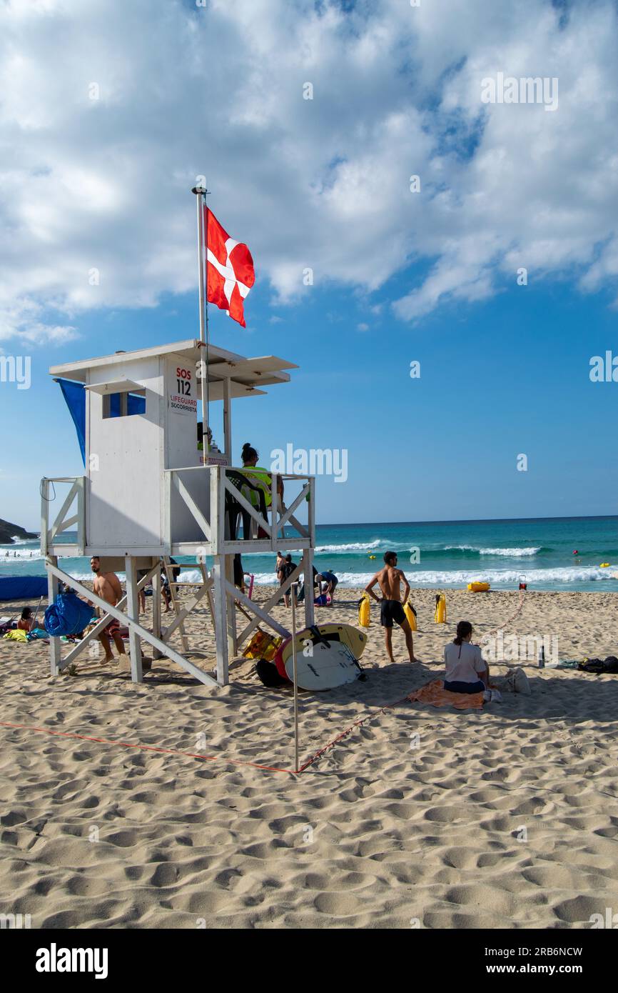 Lifeguard and First Aid tower on beach at Mallorca Island in Spain. Flag on the wind. Tower. Stock Photo