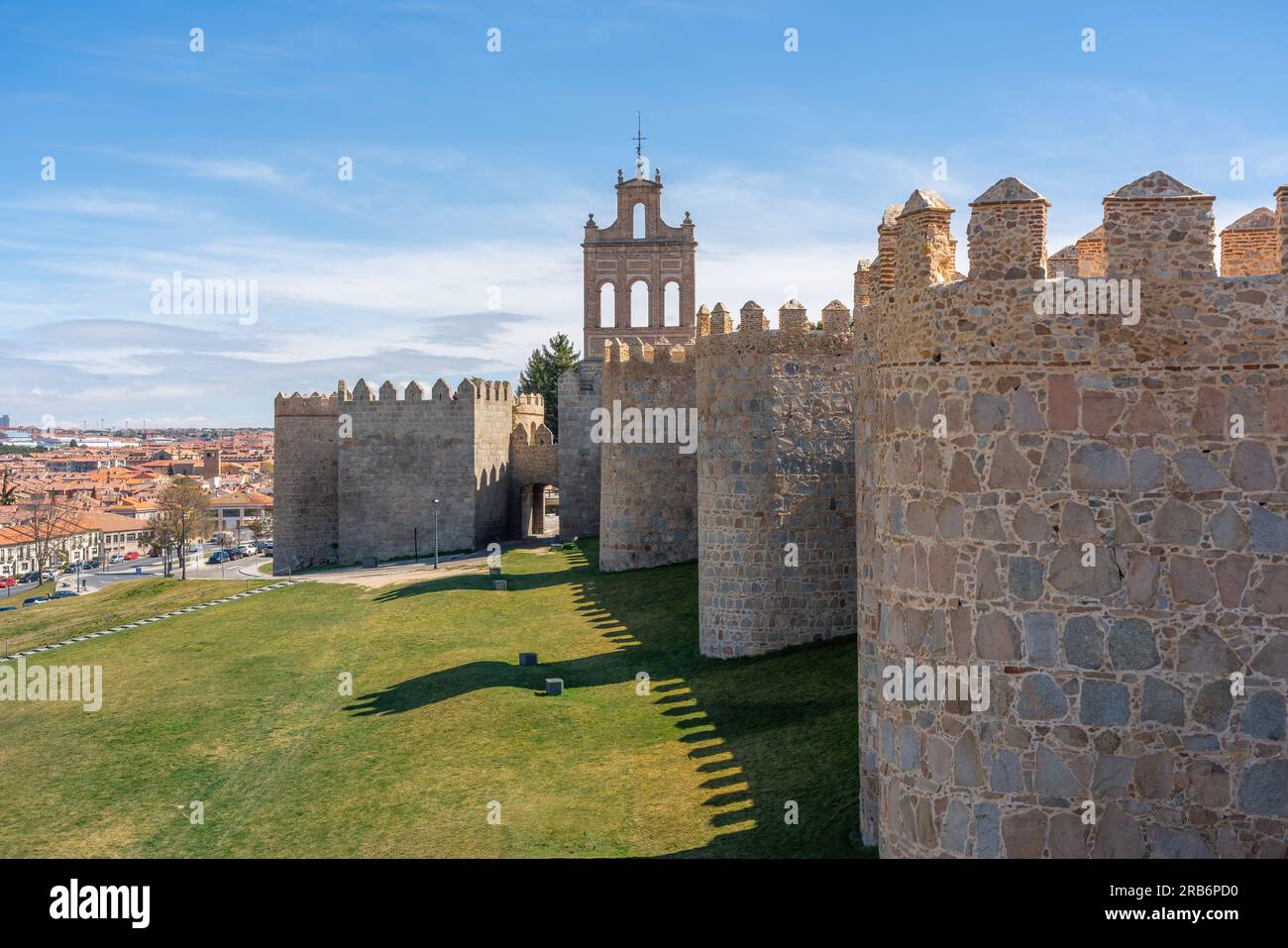 Avila Medieval Walls with Puerta del Carmen Gate and Bell Gable - Avila, Spain Stock Photo