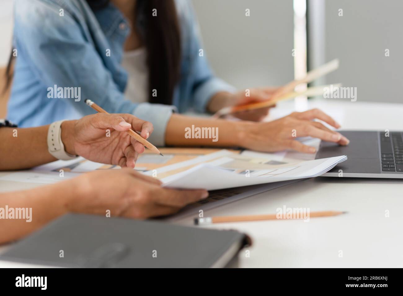 Construction design concept, Two architects is discussing about project and blueprint of building. Stock Photo