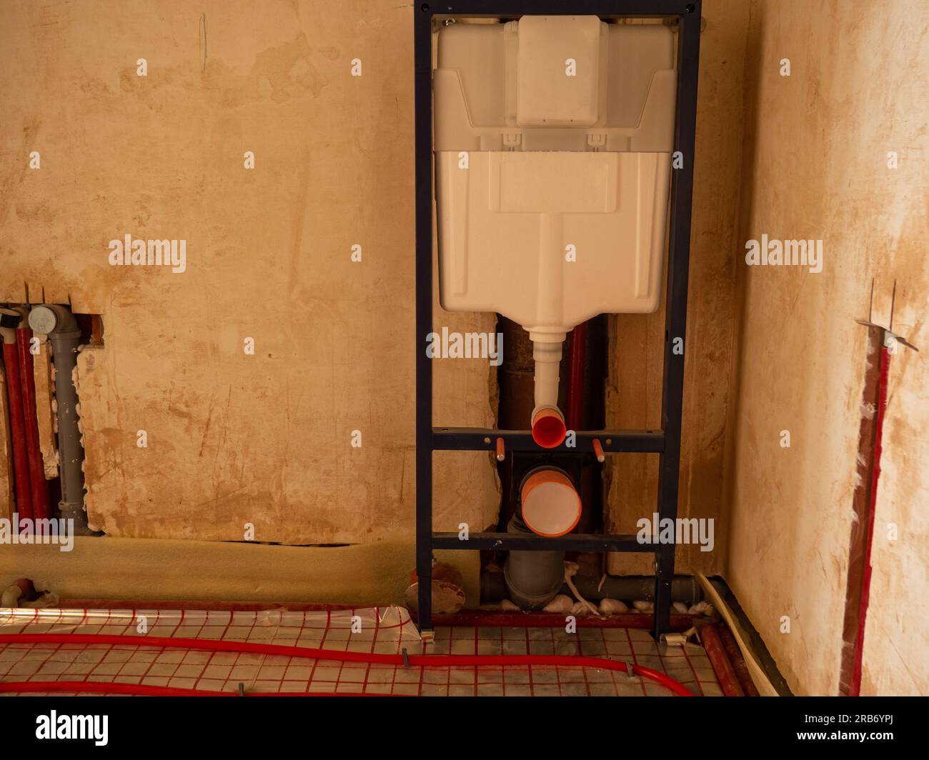 Installing heating and water pipes in apartment. Installing concealed toilet frame in bathroom