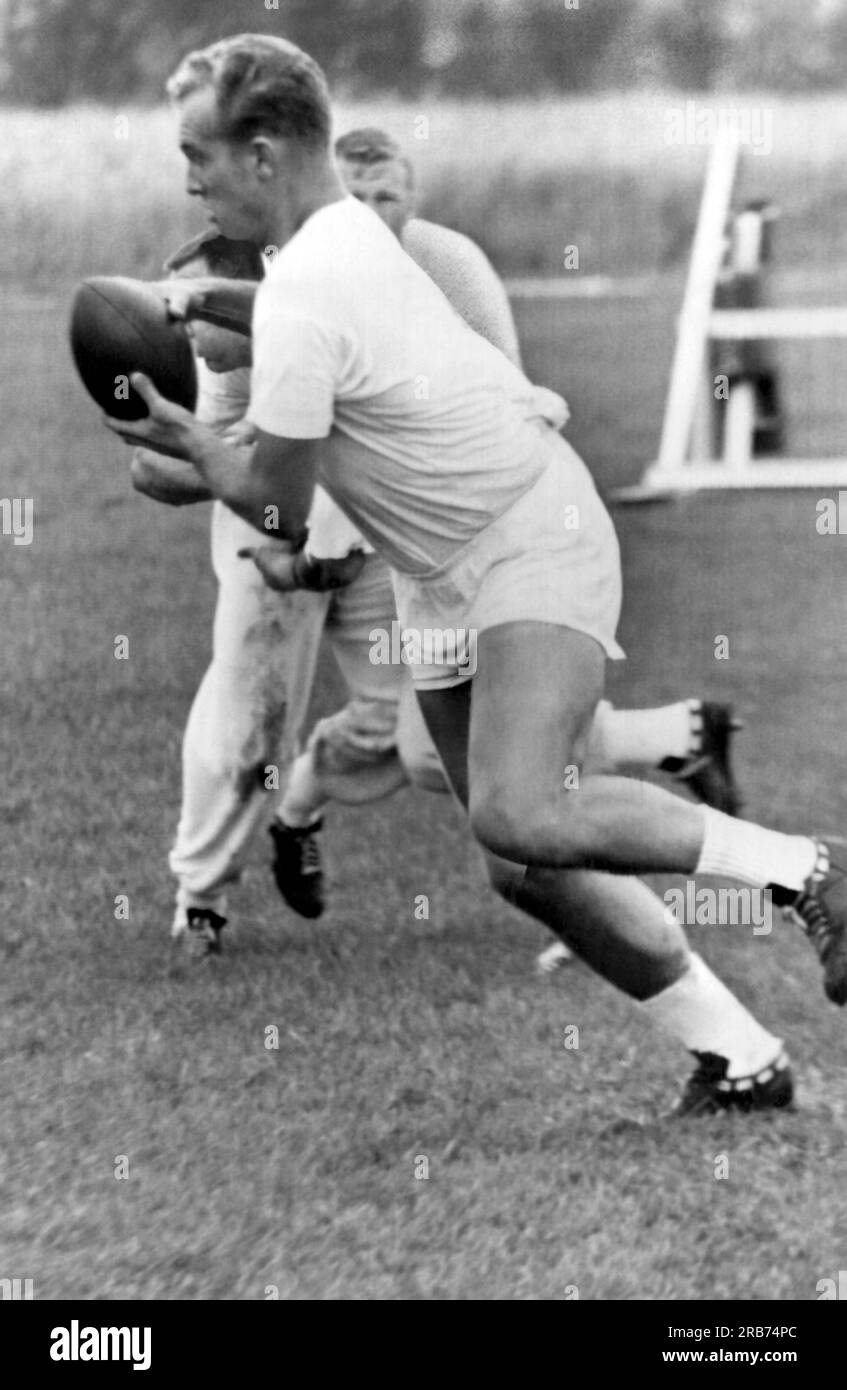 Green Bay, Wisconsin:  July 27, 1962 MVP Green Bay Packer halfback Paul Hornung works himself into shape with two a day drills at the Packer camp. Stock Photo