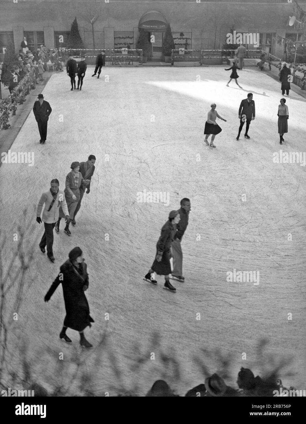 New York, New York:  c. 1936. People ice skating at the Rockefeller Center Plaza. Stock Photo
