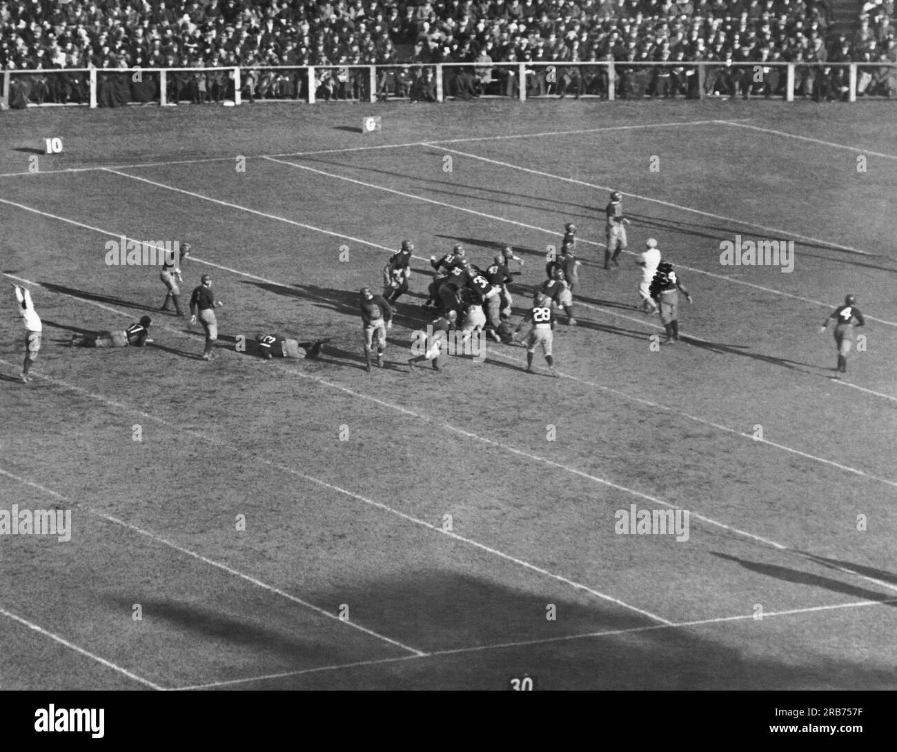 New Haven, Connecticut:  November 25, 1922 The referee signals 'Good' as O'Hearn of the Yale team drop kicks the football from the 20 yard line in its game against Harvard. Harvard won 10 to 3. Stock Photo
