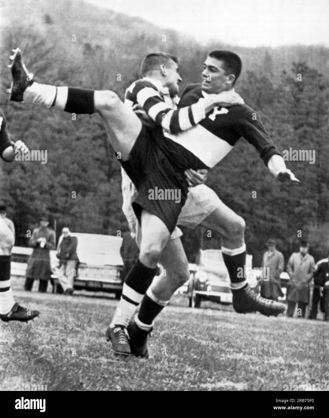 Farmington, Connecticutt:  1961 Two players from Dartmouth and Yale collide in their annual rugby match at the Farmington Polo Grounds. Stock Photo