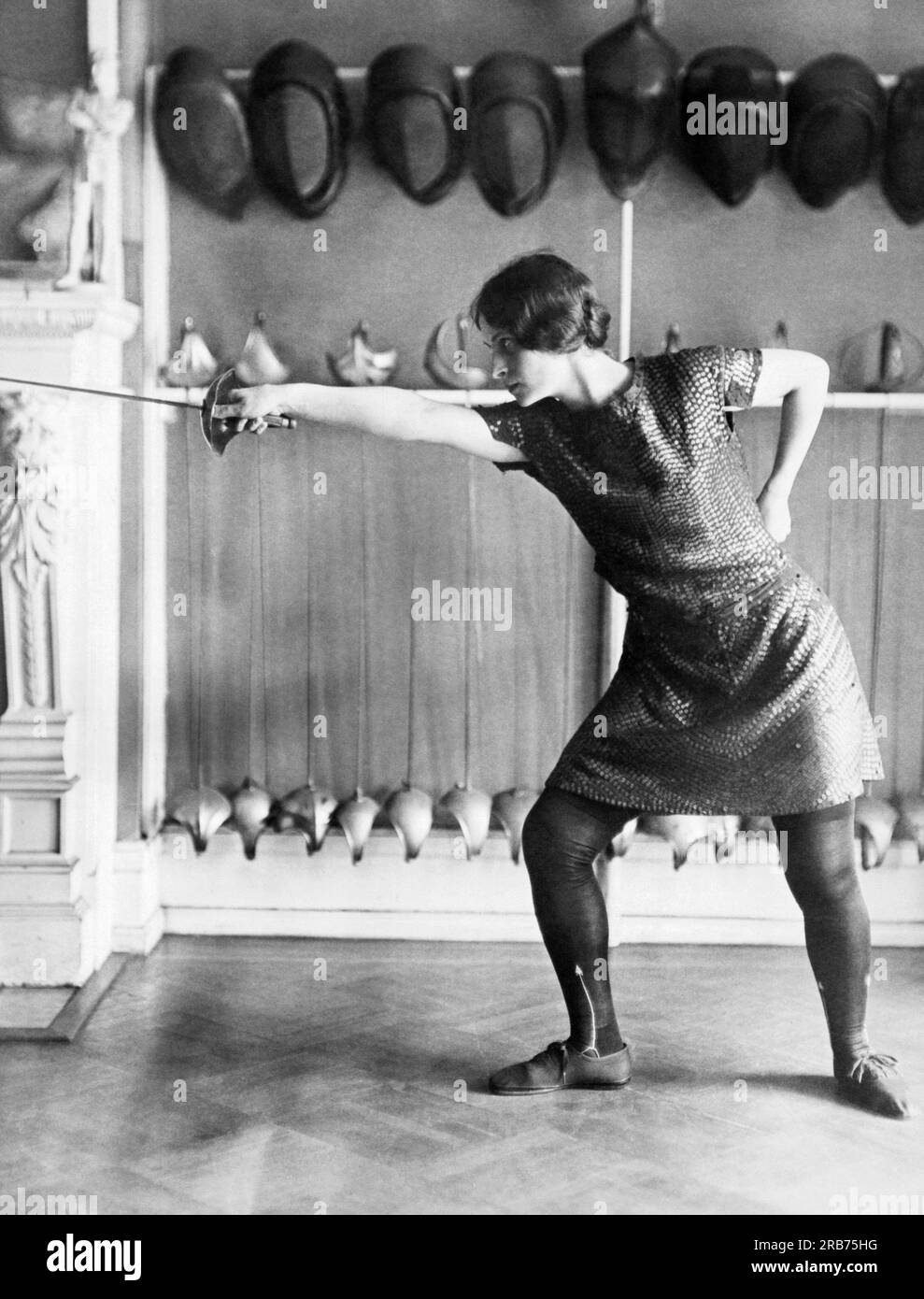 Washington, D.C.:  September, 1925 Marietta Monachino is the women's champion fencer and here is poised for a thrust and parry. Stock Photo