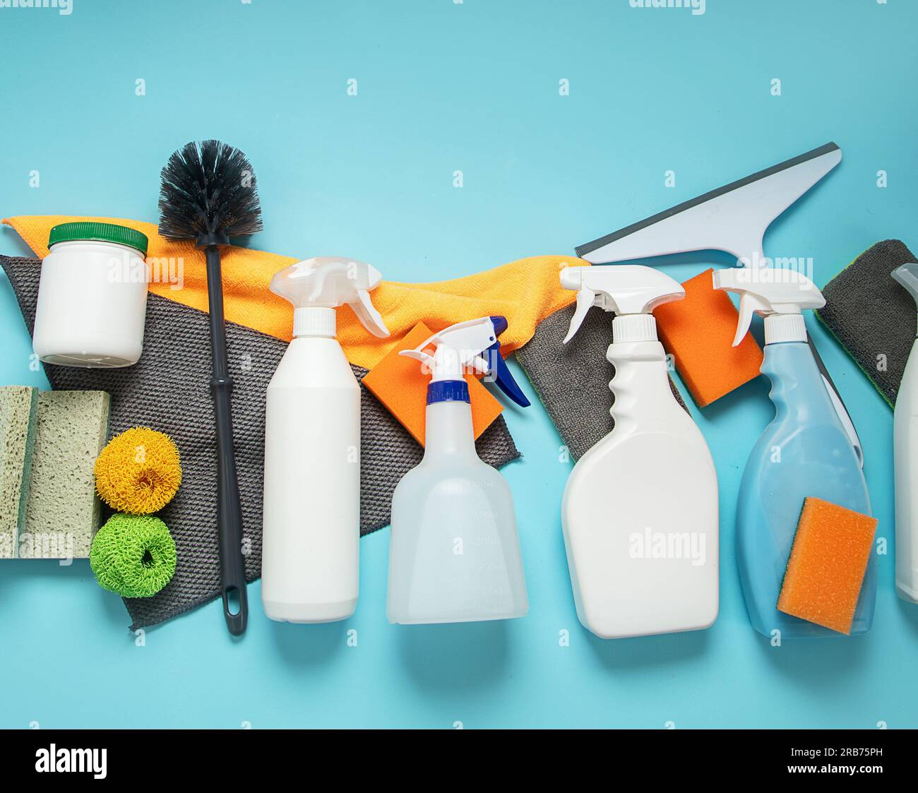 Cleaning products. Bottles, rubber gloves and sponge. Housework concept