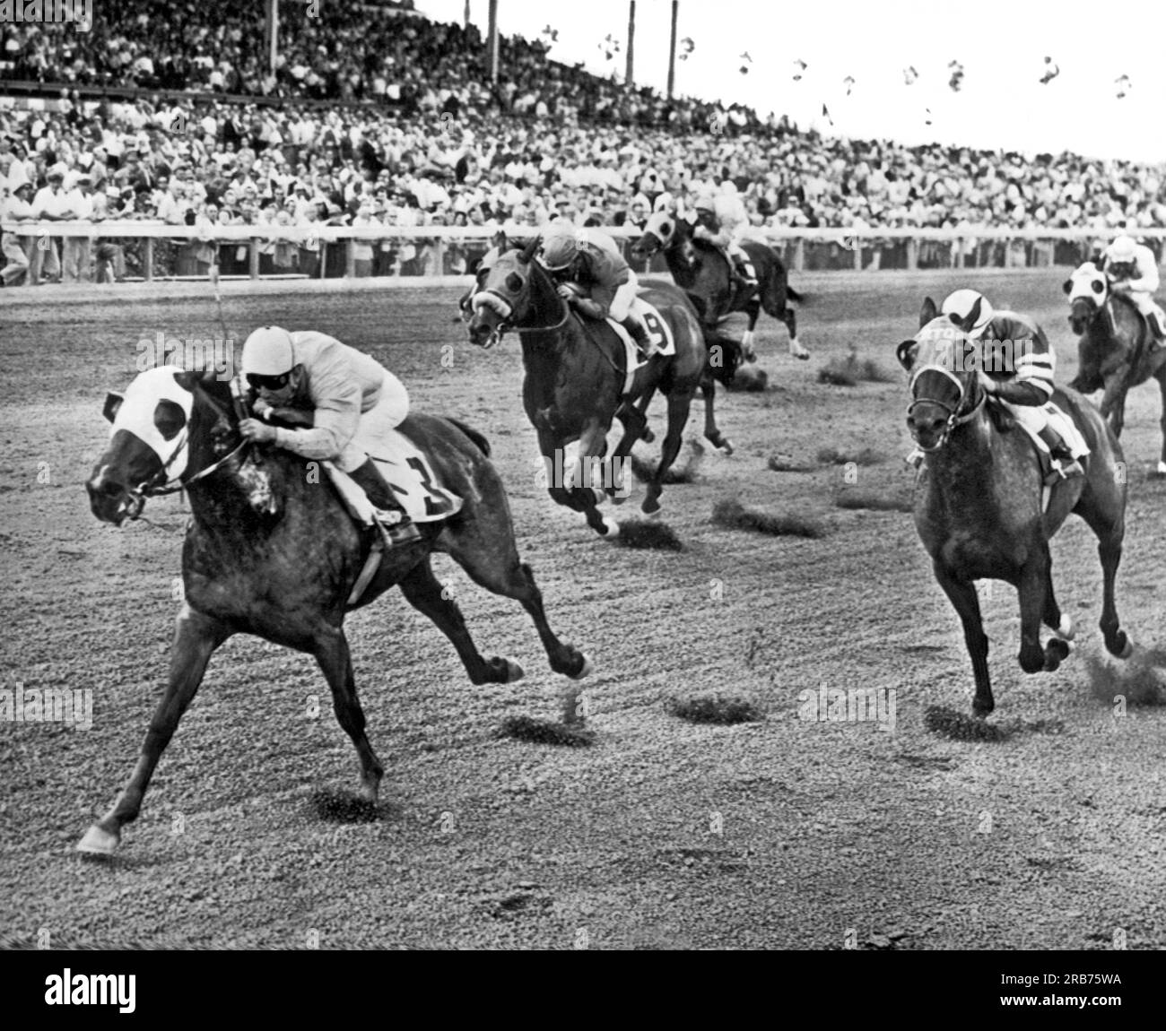 Miami, Florida:  January 6, 1962. South Star, No.3, with jockey Ovidio Diaz wins the first race at Tropical Park. Stock Photo