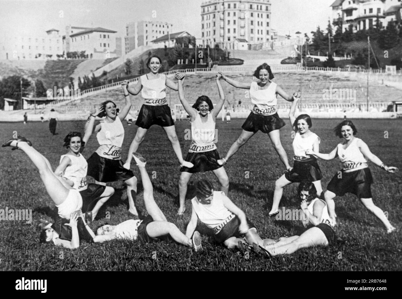 Madrid, Spain:  c. 1926. Girls from the Romea Theater doing a variety of exercises on the soccer field during the halftime of their game with the Metropolitano Theater girls. Stock Photo
