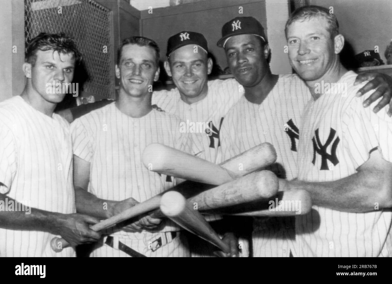 New York, New York:  July 3, 1961 New Yankee pitcher Bud Daley shows his appreciation for the linup that got him a 13-4 victory over the Washington Senators. L-R: Bill Skowron, Roger Maris, Daley, Elston Howard and Mickey Mantle. Skowron, Howard and Mantle each hit a home run in the game, with Maris hitting two. Stock Photo