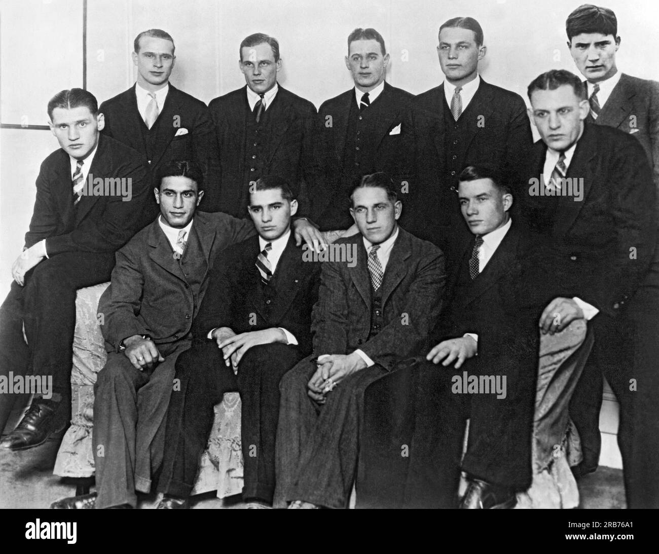 New York, New York:  December 8, 1925 A photograph of the first All-American football team ever gathered together at one time. They were guests of the NY Sun newspaper and featured at a banquet of 500 people. Top, L-R: Oberlander of Dartmouth, McMillan of Princeton,  Sturhahn of Yale, Diehl of Dartmouth, and Joss of Yale. Bottom, L-R: Tully of Dartmouth, Friedman of Michigan, Oosterbaan of Michigan, Tryon of Colgate, Weir of Nebraska, and 'Red' Grange of Illinois. Stock Photo