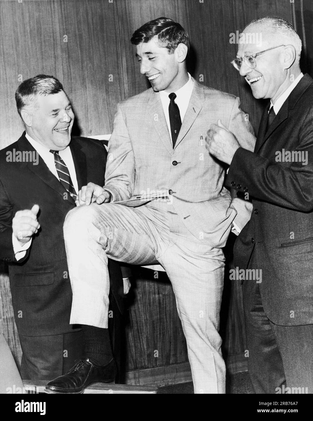 New York, New York:  1965 First round draft pick quarterback Joe Namath with New York Jets coach Weeb Ewbank (L) and Jets owner Sonny Werblin, (R). Stock Photo