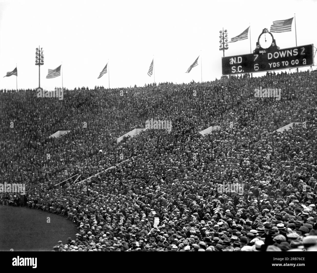 Chicago, Illinois:  November 26, 1927. The scoreboard and crowd at halftime during the Notre Dame-USC football game at Soldiers Field. The Fighting Irish won the game by the same score. Stock Photo