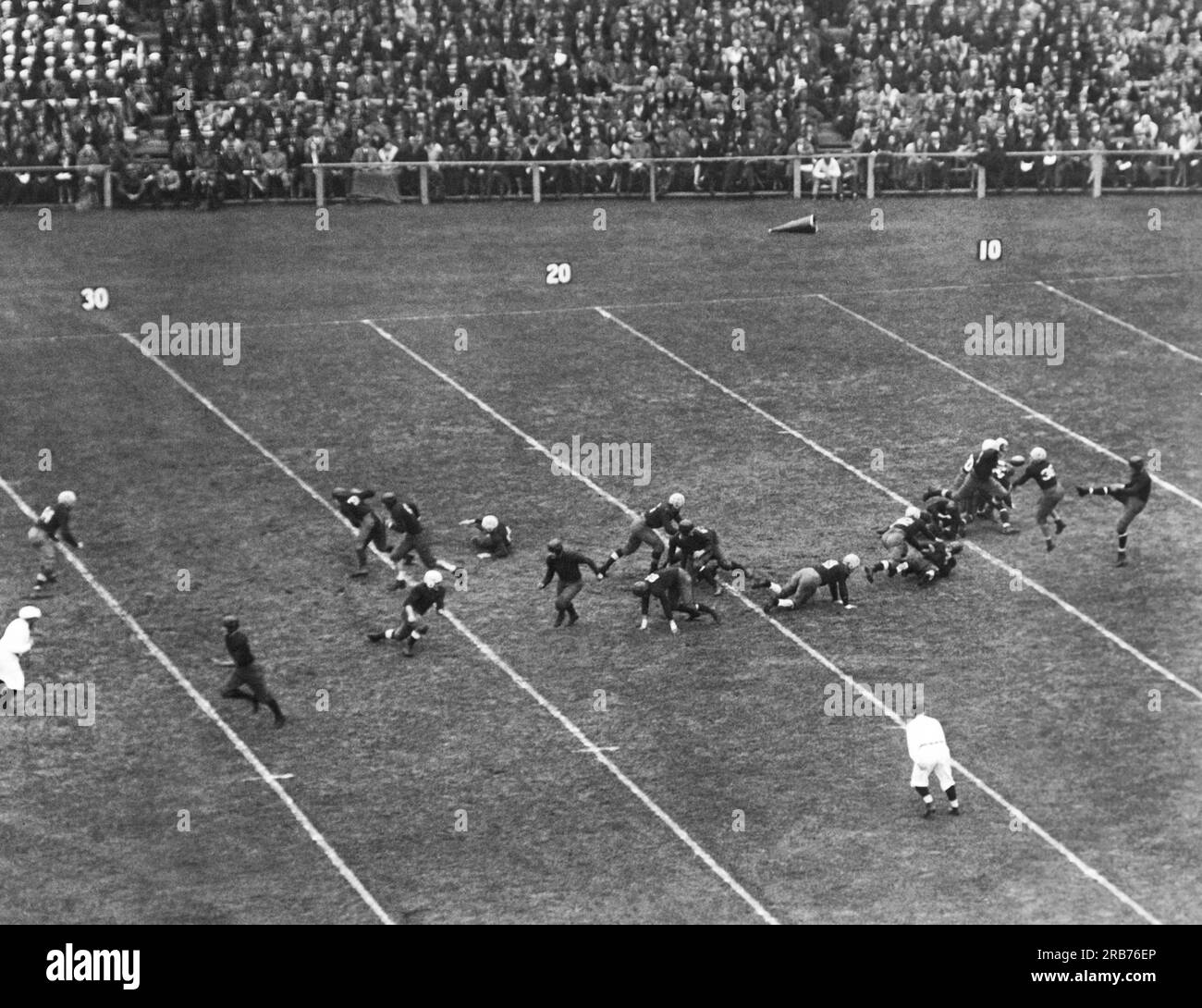 New Haven, Connecticut:    November 11, 1930 Harvard blocks Yale's Albie Booth's kick in the annual Harvard-Yale football game. Harvard Crimson won the game, 13 to 0. Stock Photo