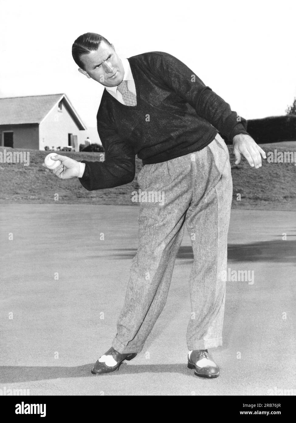 New Jersey c. 1953 A man posing with different sports gear and showing